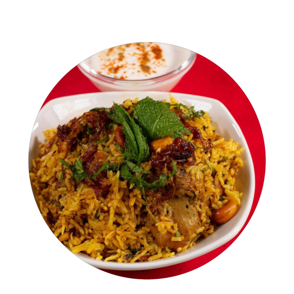 Chicken biryani garnished with fresh herbs